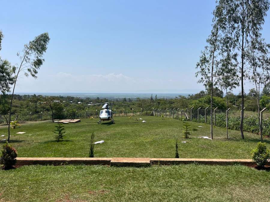 Private helipad grounds bordered by lawn and fencing